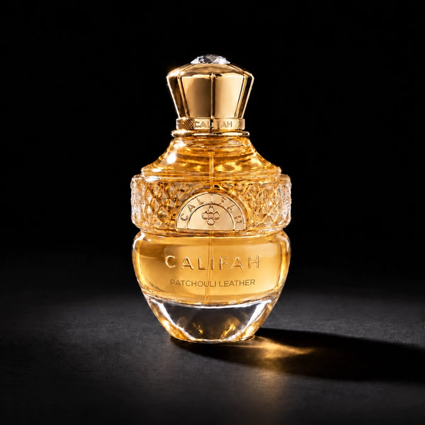 CALIFAH Patchouli Leather perfume bottle with a gold cap and faceted glass detailing against a black background.