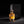 Luxury CALIFAH Patchouli Leather Parfum bottle displayed beside its elegant black box on a dark background with warm golden lighting.