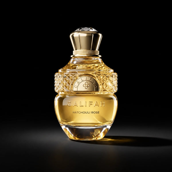 CALIFAH Patchouli Rose perfume bottle with golden liquid, faceted glass detailing and a gold cap against a black background.