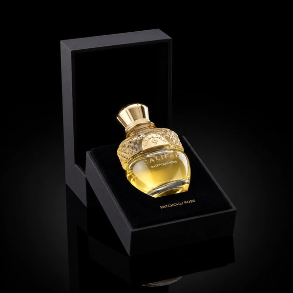 CALIFAH Patchouli Rose perfume bottle nestled in an open black presentation box with a velvet interior.