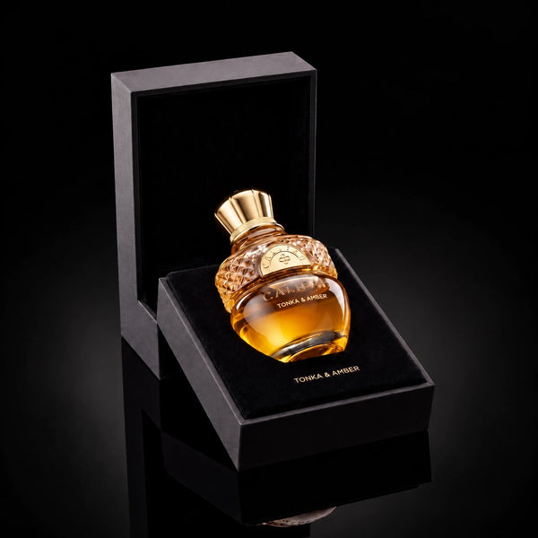CALIFAH Tonka & Amber perfume bottle nestled in an open black presentation box with a velvet interior.